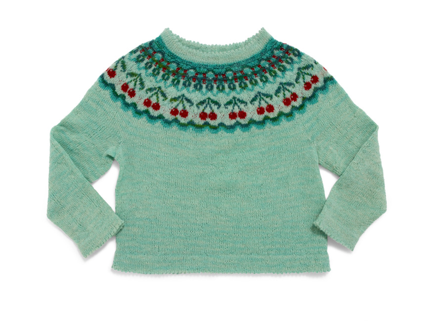 Oktröja med ljusturkos botten och mönster i rött och turkos.